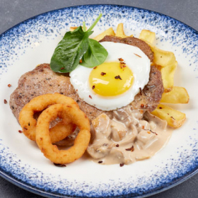 Отбивная из свинины с грибами и с картофельными лодочками